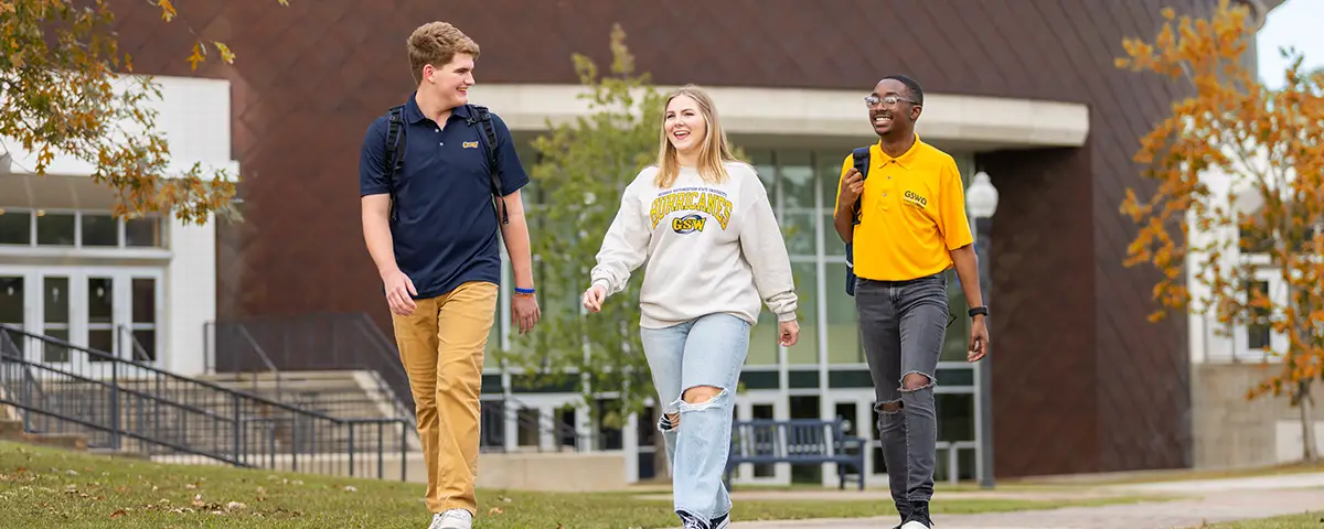 three students walking on campus