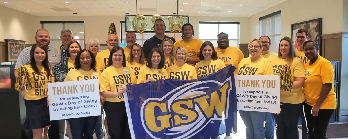 faculty and staff wear gold on Day of Giving