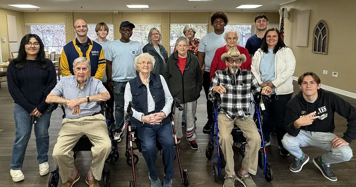 Computer Club students with senior citizens