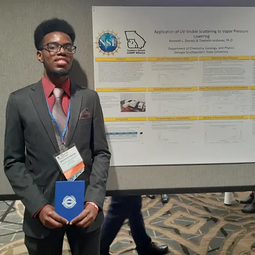 KJ in front of his conference poster